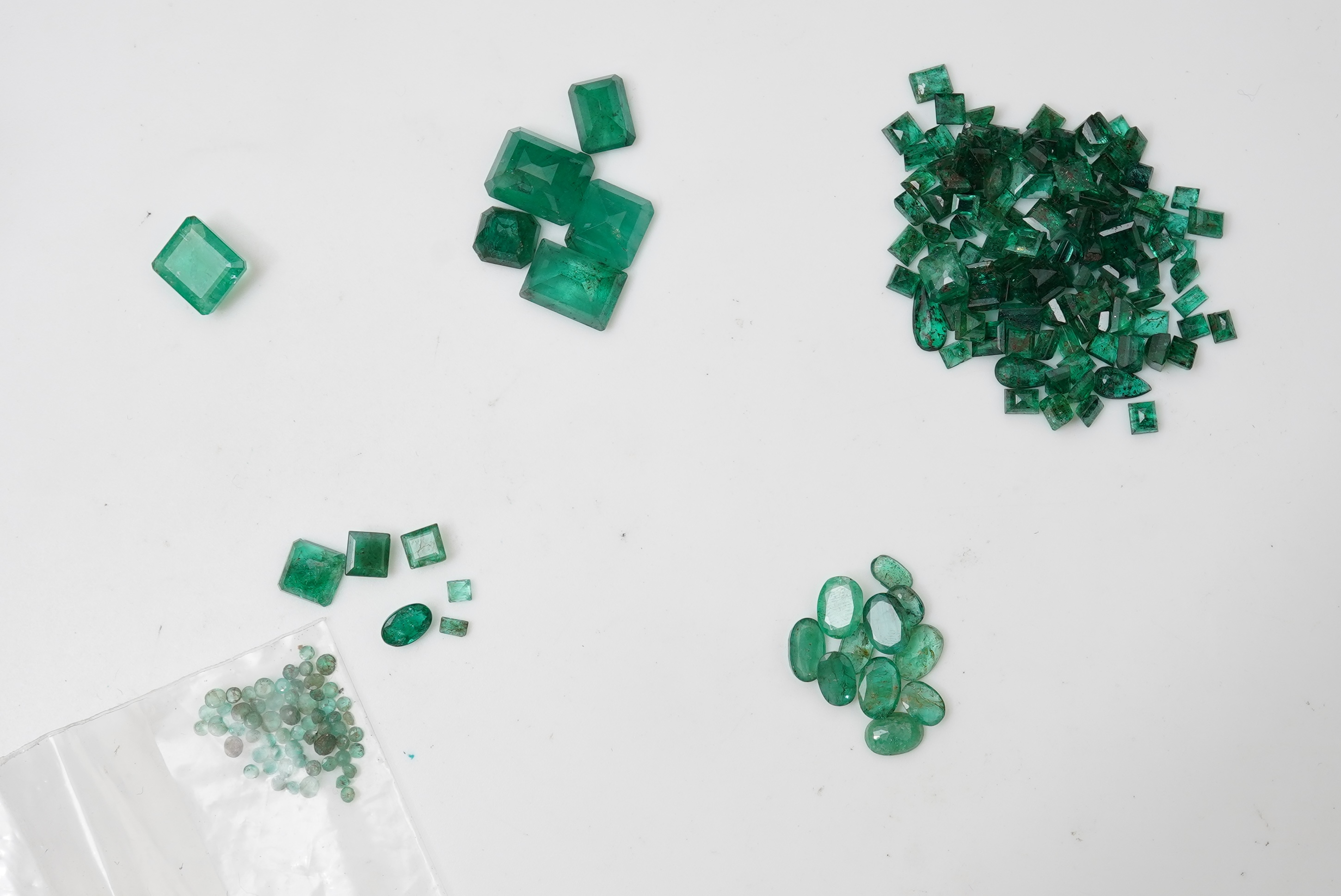 A collection of loose emeralds